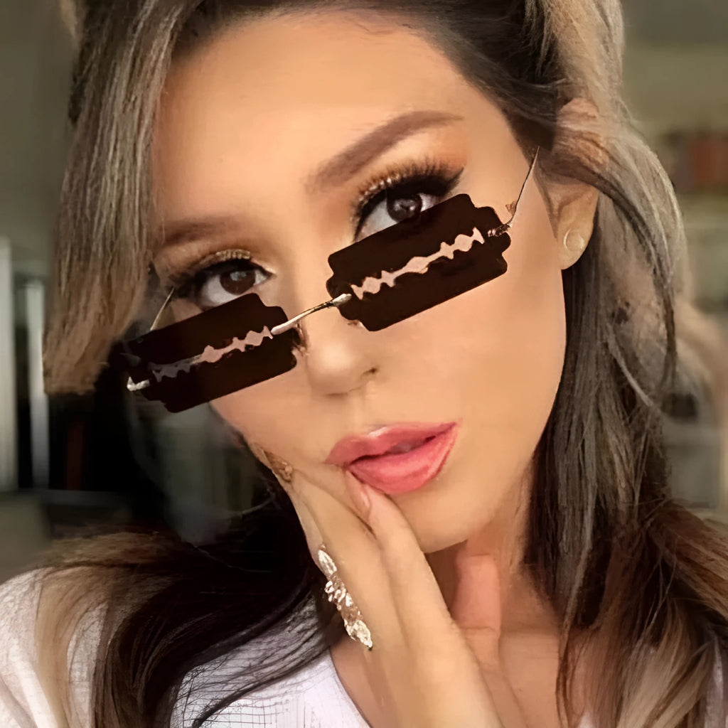 Women's gold metal rimless sunglasses with UV400 PC lenses on a light background