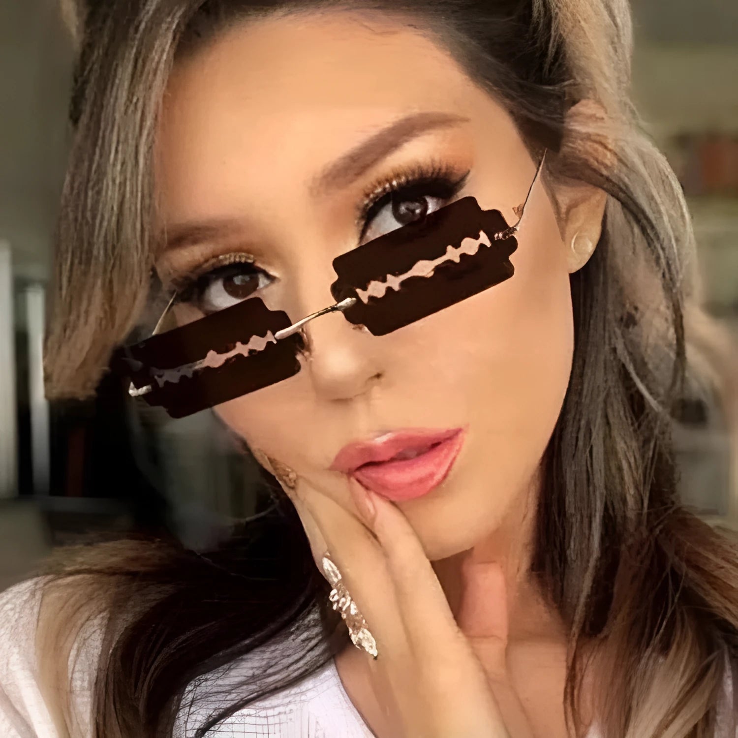 Women's gold metal rimless sunglasses with UV400 PC lenses on a light background