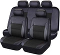 Black synthetic leather car seat cover installed on a front car seat, showing stitched design.