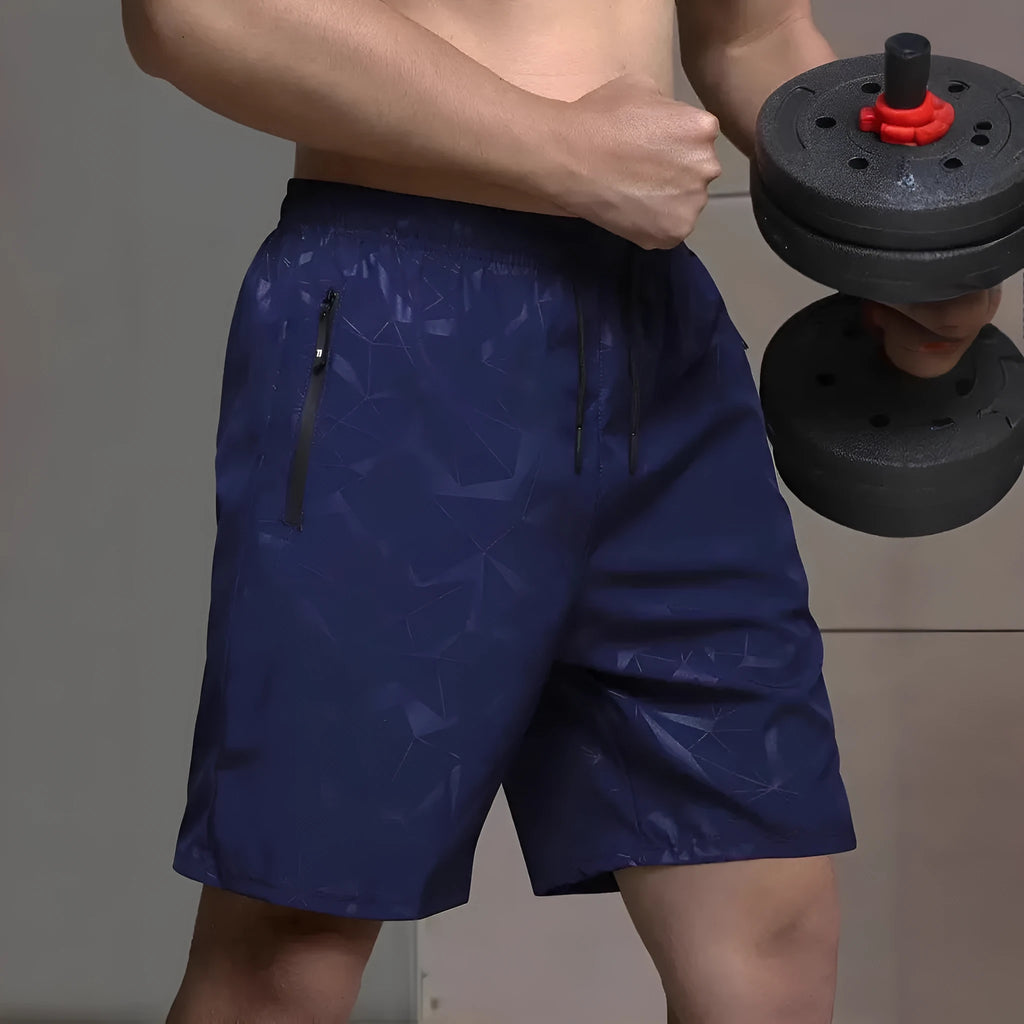 Men's loose-fit black polyester sports shorts with elastic waistband laid flat.
