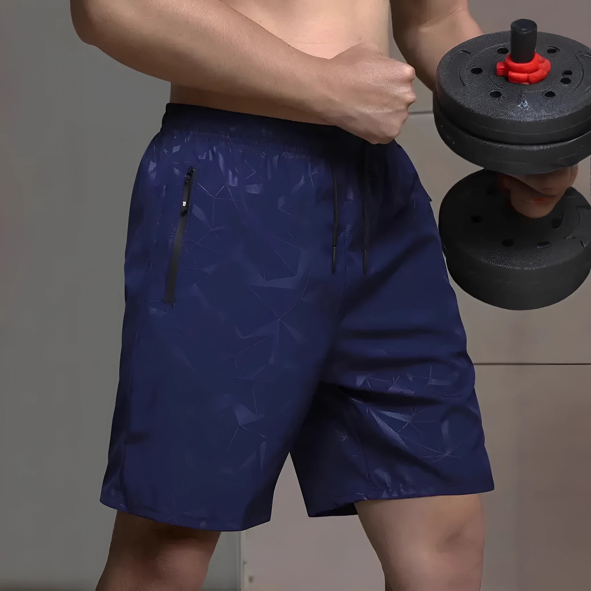 Men's loose-fit black polyester sports shorts with elastic waistband laid flat.