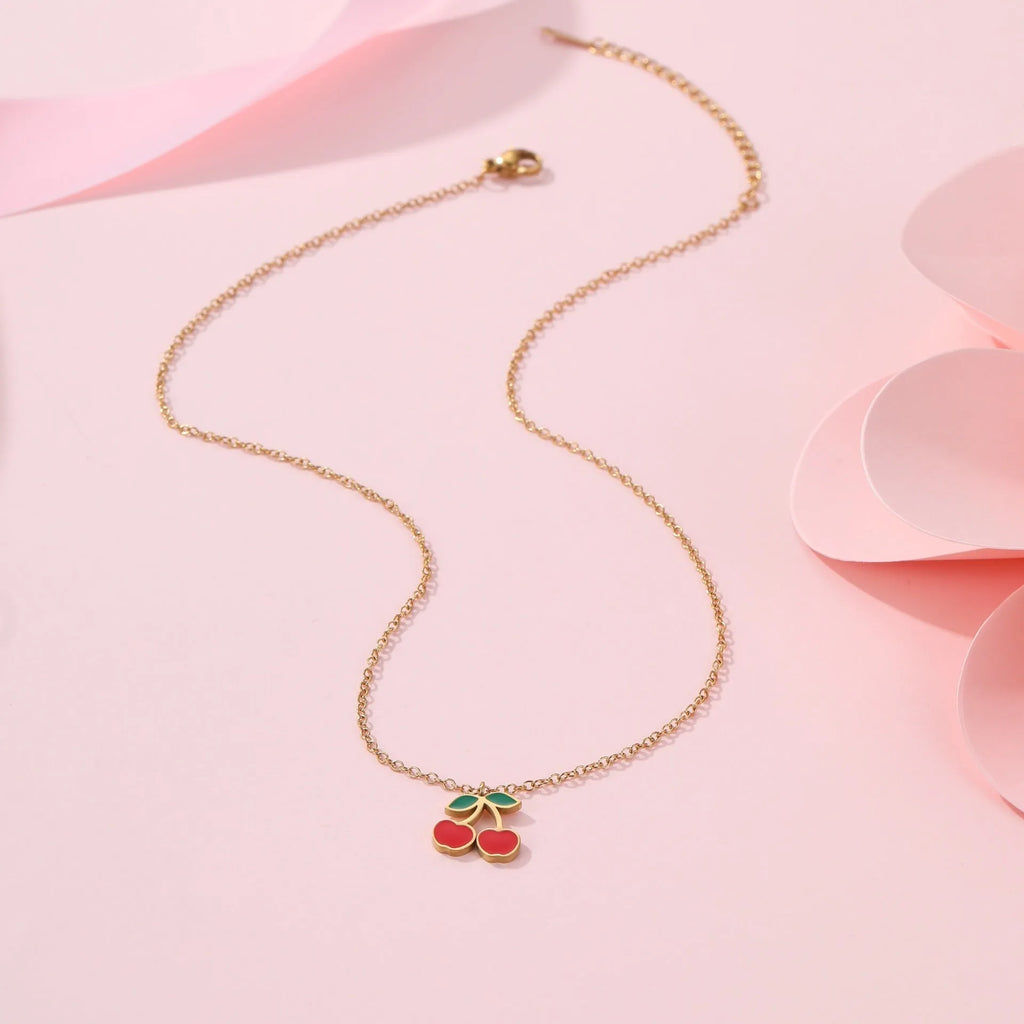 Cherry jewellery set showing necklace, bracelet, earrings, and ring with stainless steel construction