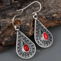 Silver drop-shaped retro earrings for women with European and American national style design.