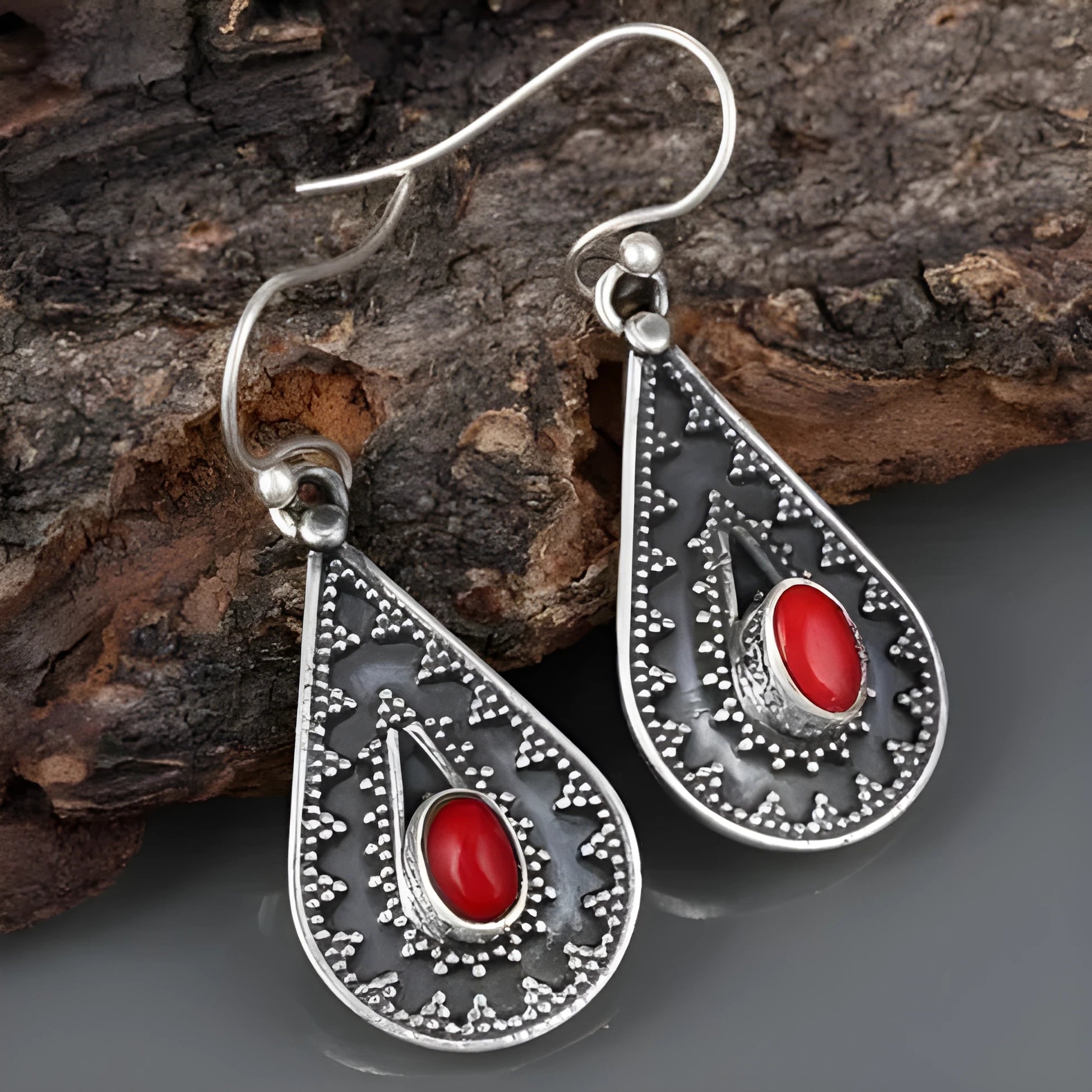 Silver drop-shaped retro earrings for women with European and American national style design.