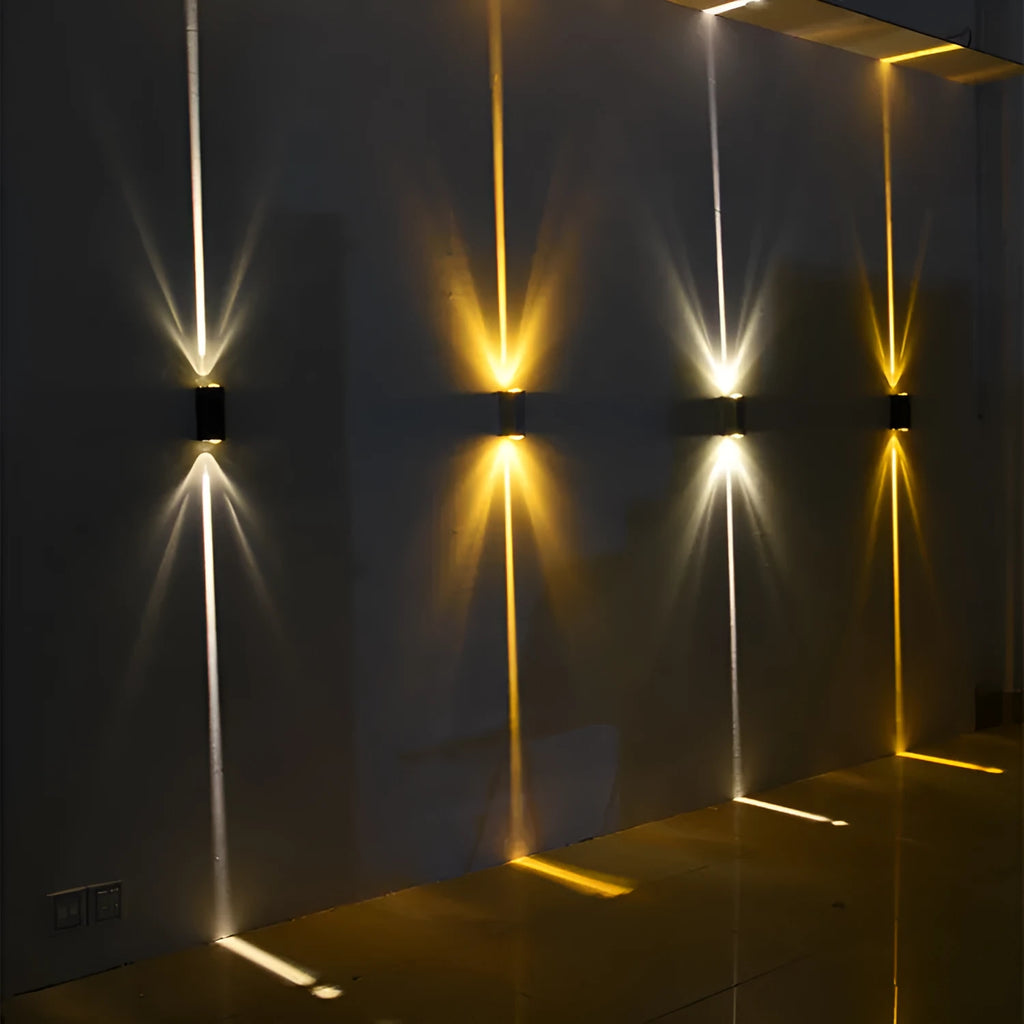 Waterproof LED wall spotlight with aluminium body and shade, black or silver, 4W or 6W, warm white or yellow light