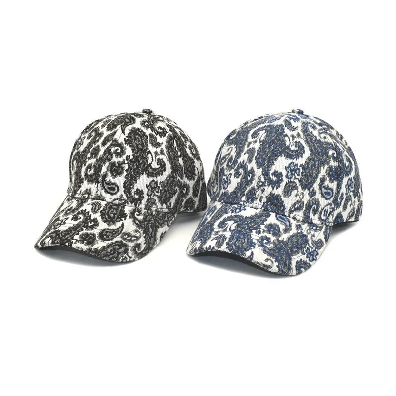 Blue polyester baseball cap with paisley pattern print and dome crown design on a white background.