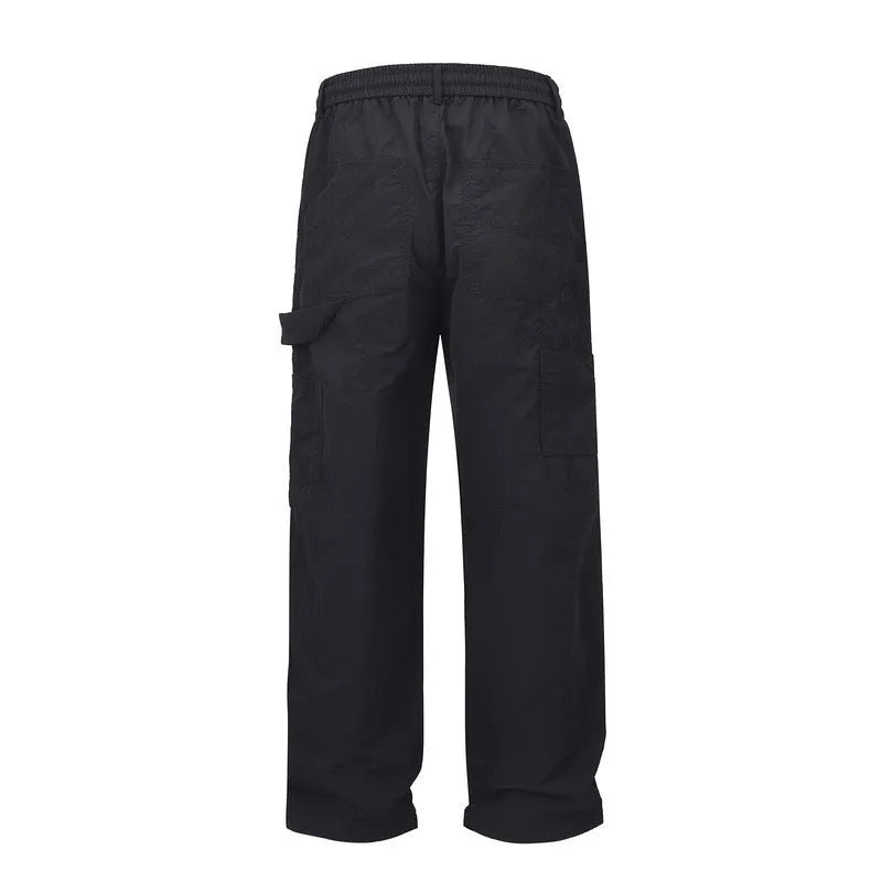 Black paratrooper pants with elastic waist and baggy style European American high street cut