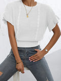 Loose fit knitted sweater with round neck and ruffled short sleeves in dark brown.