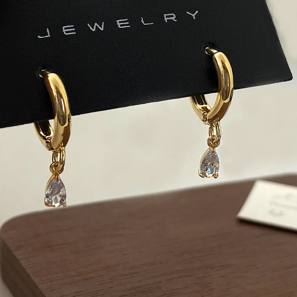 Geometric zircon necklace, earrings, and anklet set in a Korean-style meteor shower design.