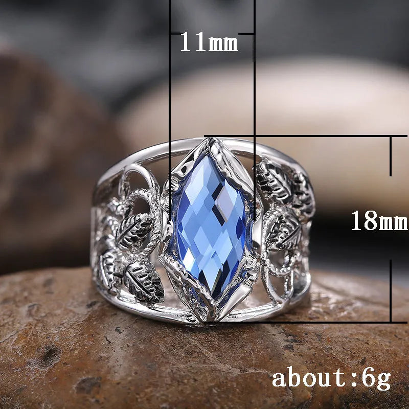 Women's blue crystal horse eye-shaped geometric alloy ring on a white background.