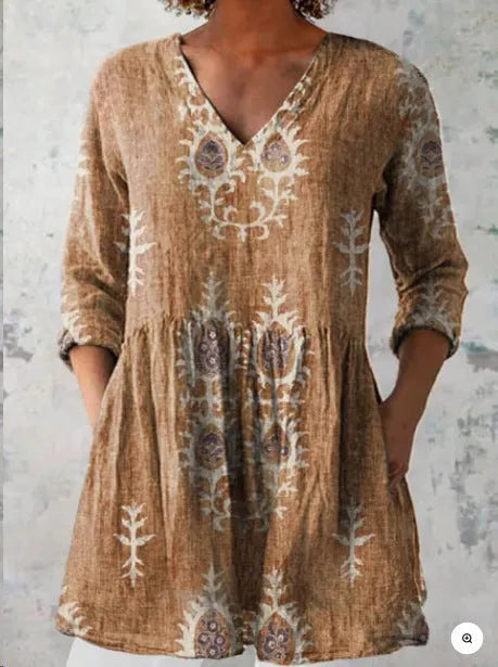 Women's printed loose dress with wide waist and three-quarter sleeves in a wave pattern.
