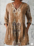 Women's printed loose dress with wide waist and three-quarter sleeves in a wave pattern.