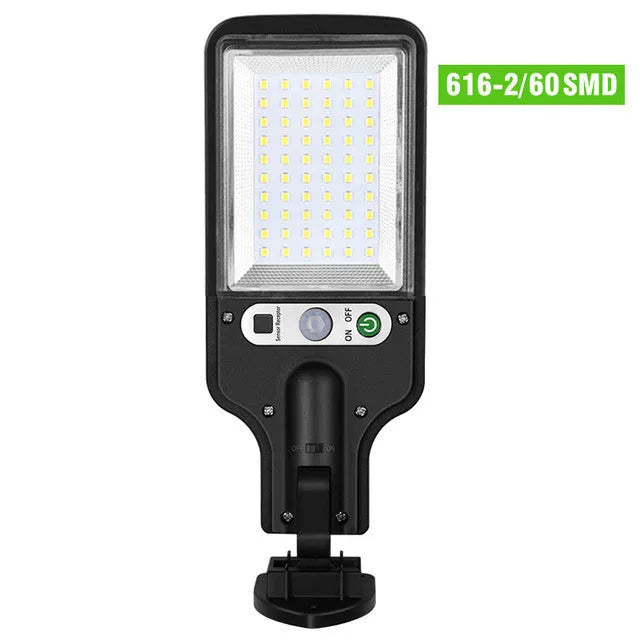 Outdoor solar LED wall lamp 28LED variant mounted on a garden fence for patio lighting