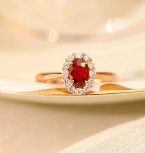 Gold pigeon motif women's ring with red blood ruby artificial gemstone and floral design in silver and gold plating