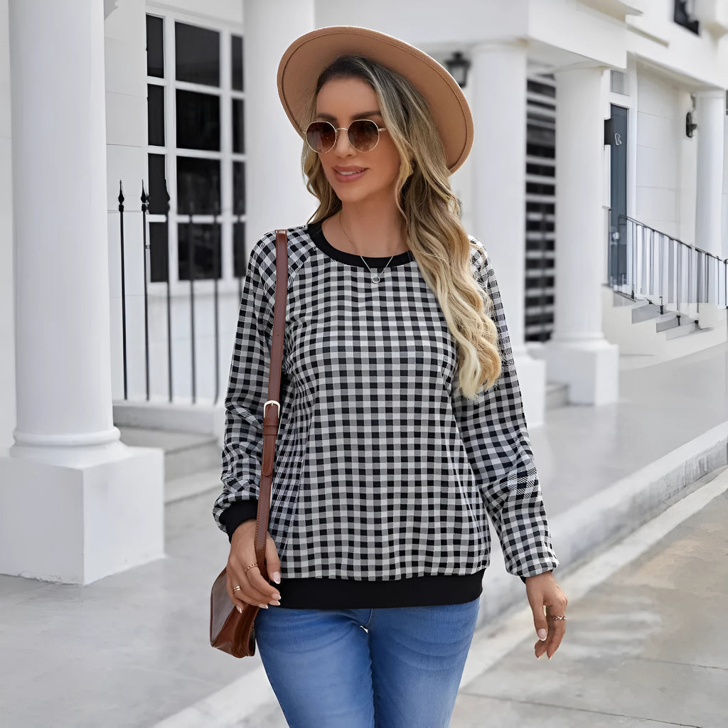 Black long sleeve pullover sweater with a Japanese sweet plaid and striped pattern.