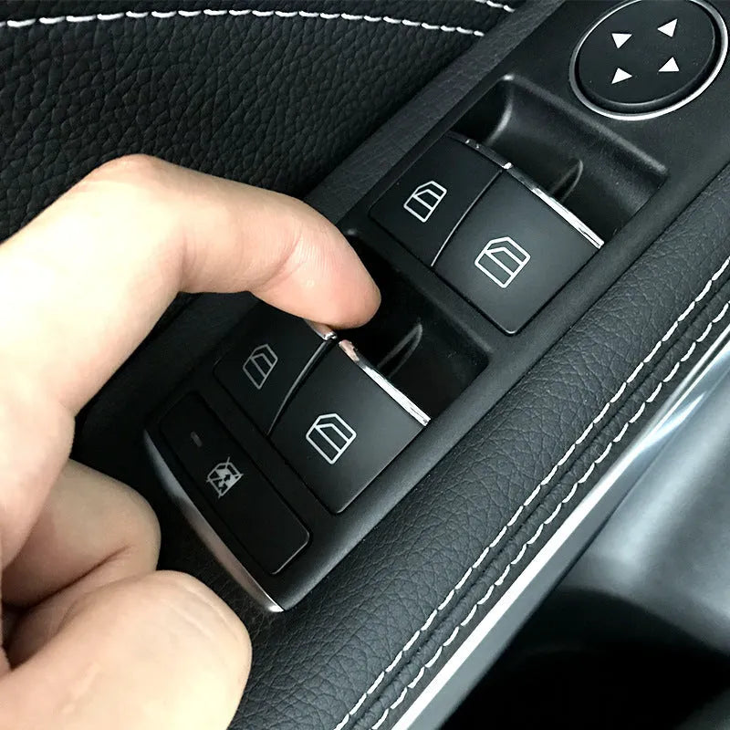 Black glitter decorative sticker for a car window lift button on a white background.