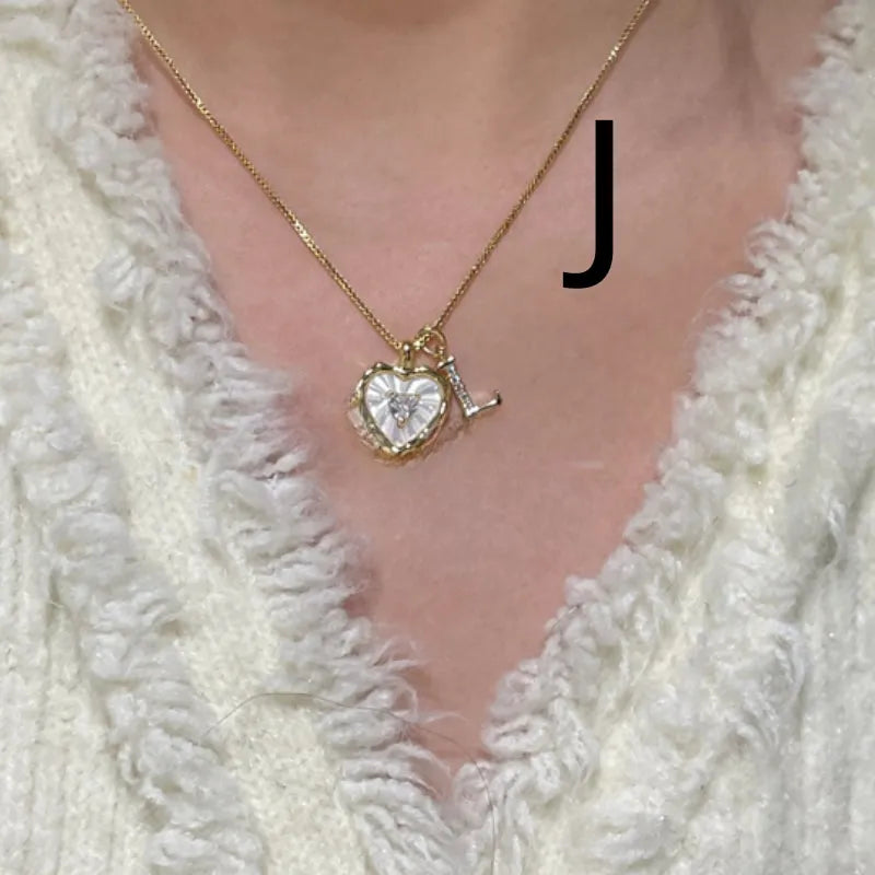 Women's pendant necklace with titanium steel chain and natural mother-of-pearl in heart-shaped design