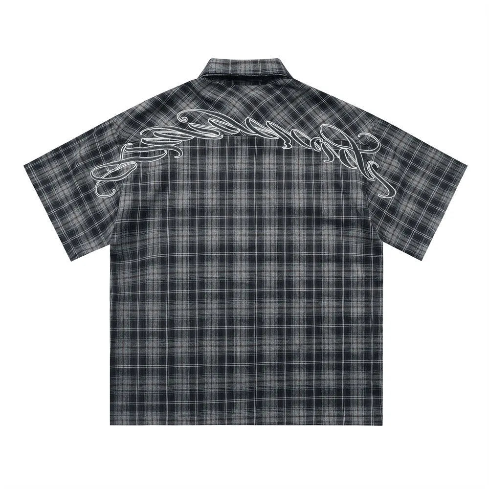 Men's black plaid short sleeve shirt with embroidered letter design on lapel