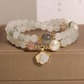 Women's crystal bracelet with a green Tianshan jade shell ginkgo leaf pendant, gold-plated accents, and rhinestones.