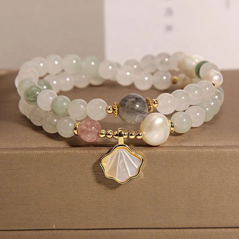 Women's crystal bracelet with a green Tianshan jade shell ginkgo leaf pendant, gold-plated accents, and rhinestones.