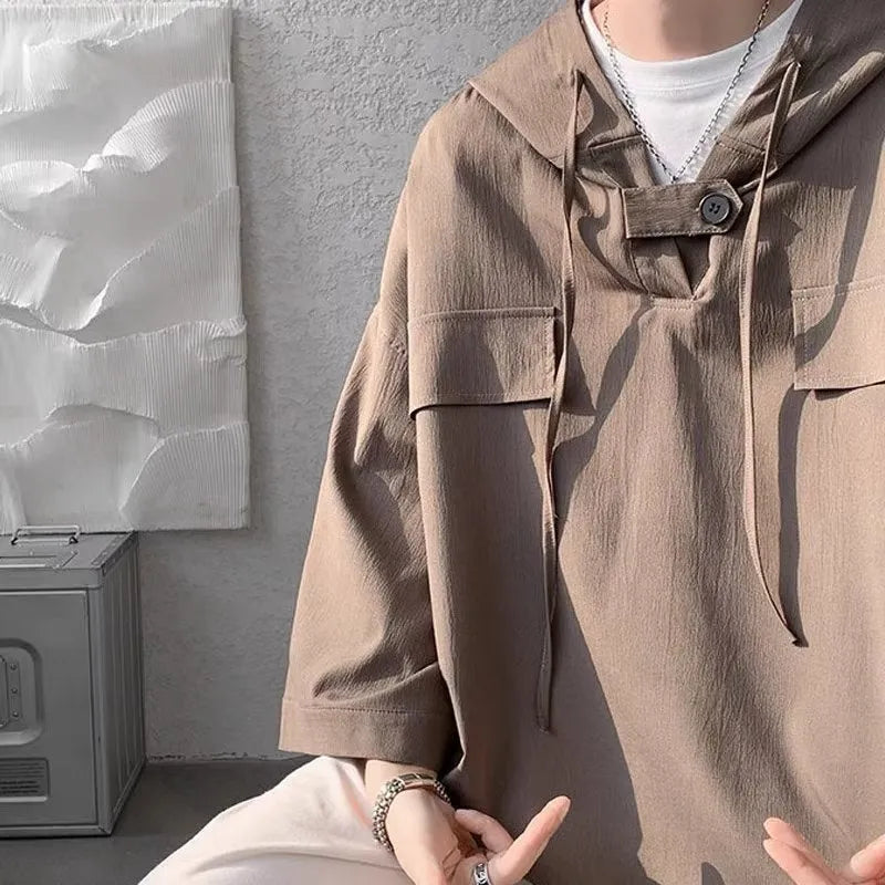 Men's hooded short sleeve t-shirt in loose fit available in multiple colours including black, white, and blue