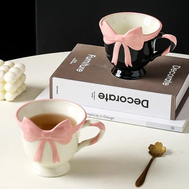 Ceramic mug with a cute girl heart bow design in white powder and black pink colours.
