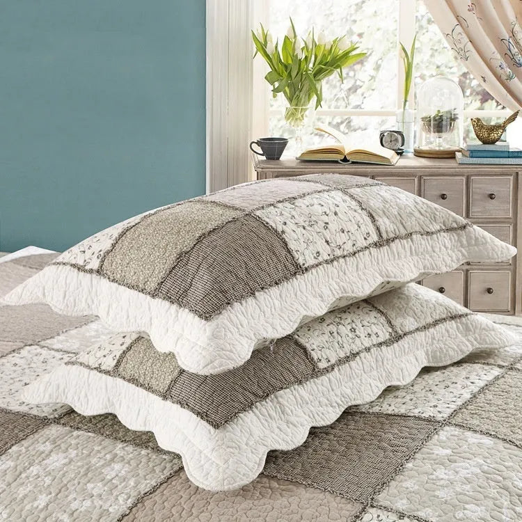 Washed pure cotton quilted bedspread three-piece set in a beige colour, shown on a bed.