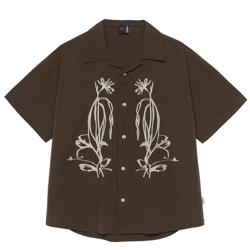 Brown striped men's short sleeve outdoor shirt with Cuban collar on a hanger