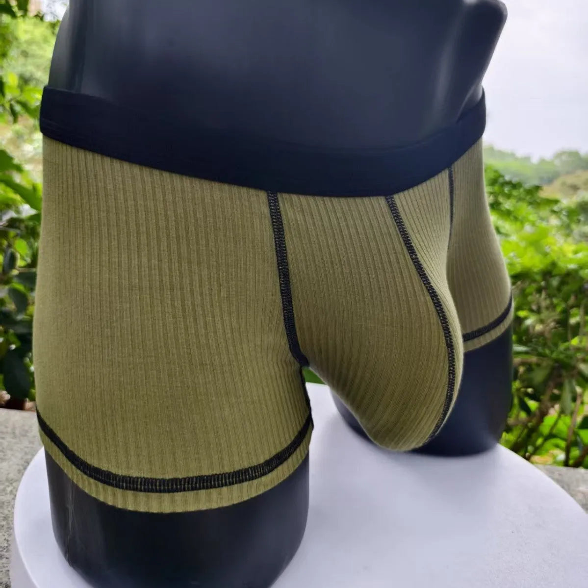 Men's breathable boxer shorts in army green colour showing lightweight fabric and shaping design