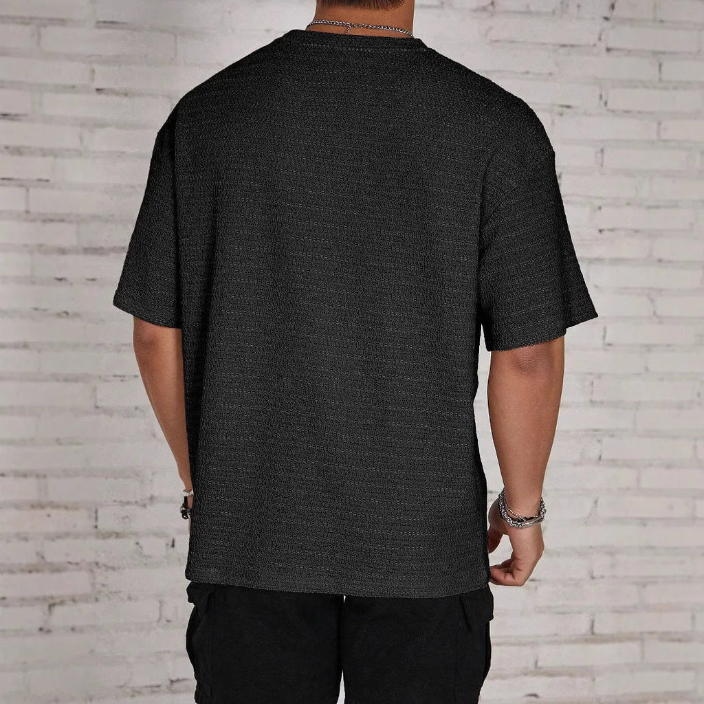 Men's slim fit short sleeve t-shirt in light blue with a round neck and loose hollow design.