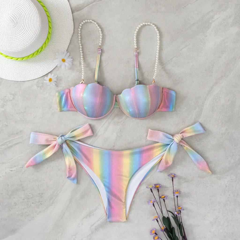 Women's rainbow colour adjustable tied bikini swimsuit on a hanger.