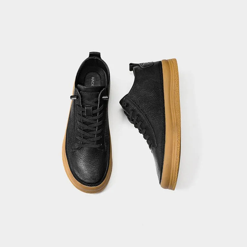 Men's black leather lace-up casual shoes with a round toe and flat rubber sole.