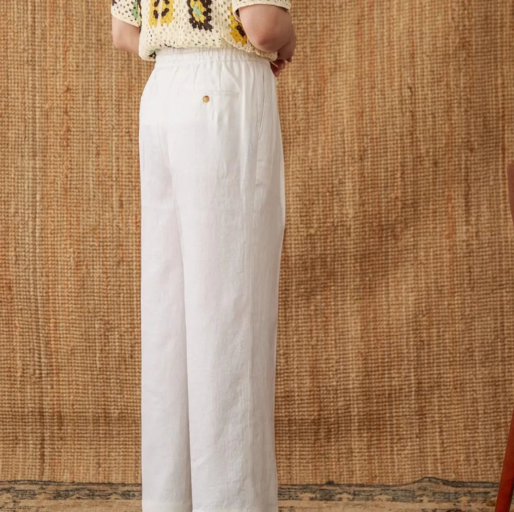 Women's linen high-waist trousers with a loose straight-leg cut and elasticated waistband in greige.