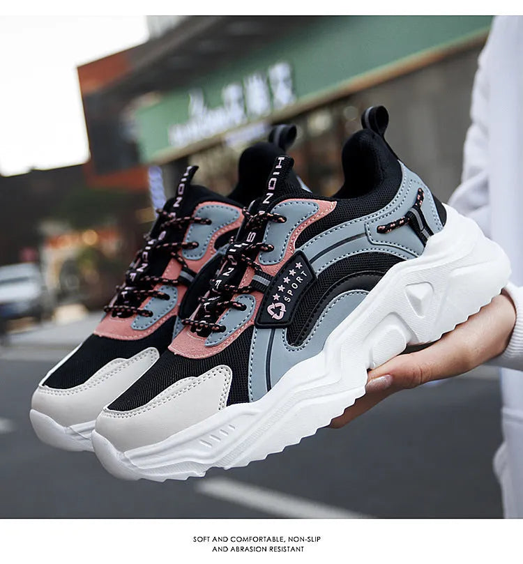 Women's white casual sports shoes with mesh upper, thick PU sole, and a buckle fastening.