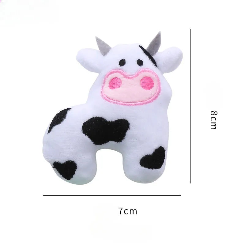 Plush cat toy shaped like a cow, a parrot, or a crocodile with catnip for bite-resistant interactive play.