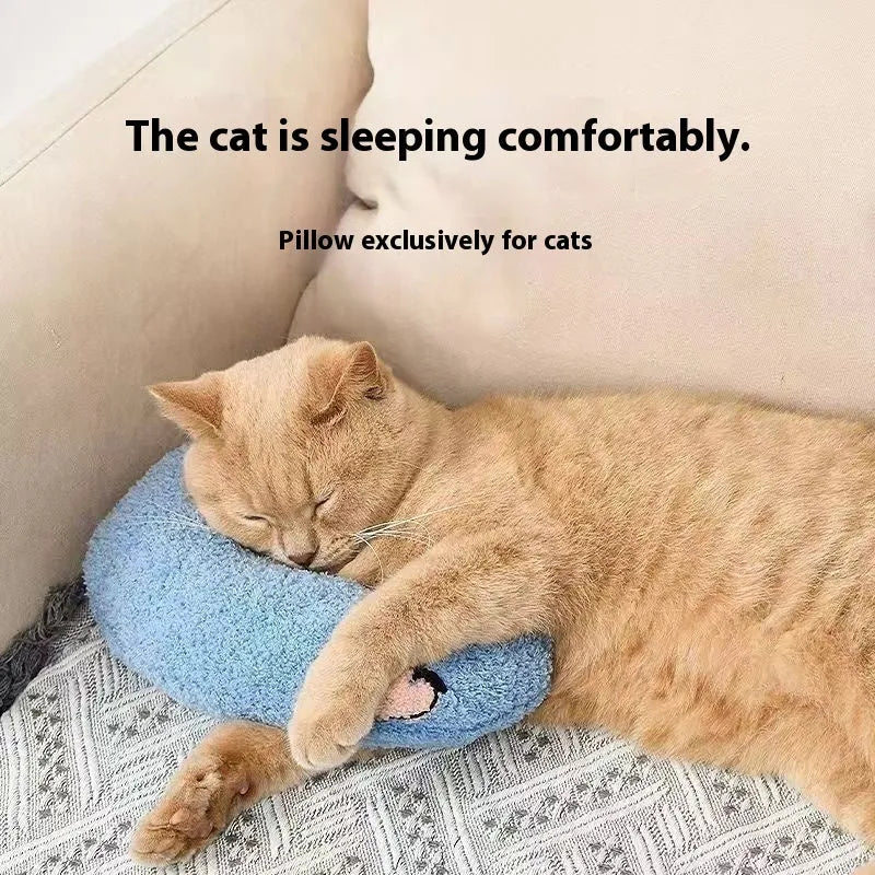 Blue Question Mark shaped cat sleeping mat with integrated U-shaped neck support pillow on a cage floor.