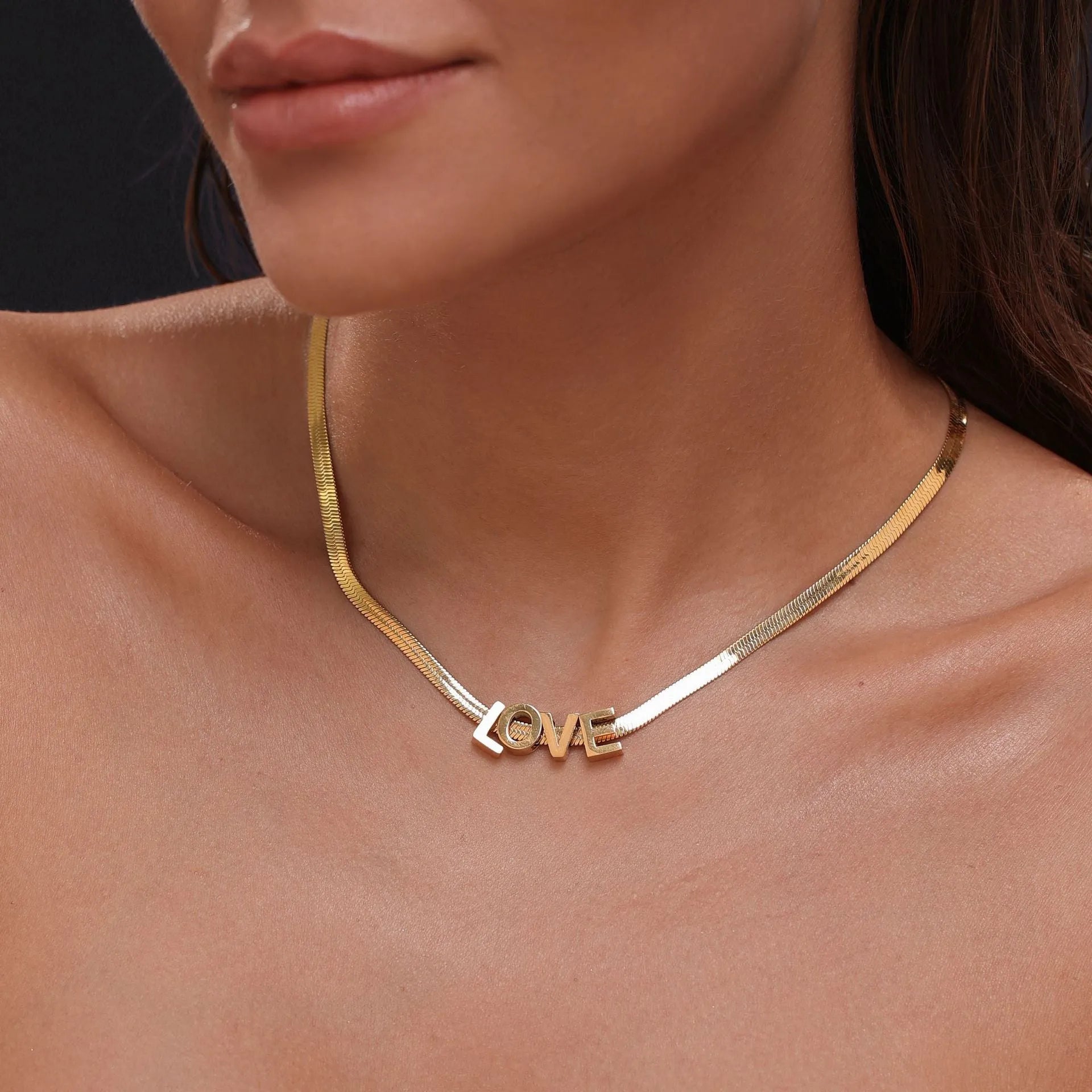 Gold titanium steel necklace with a letter A pendant on a 40.5cm chain.