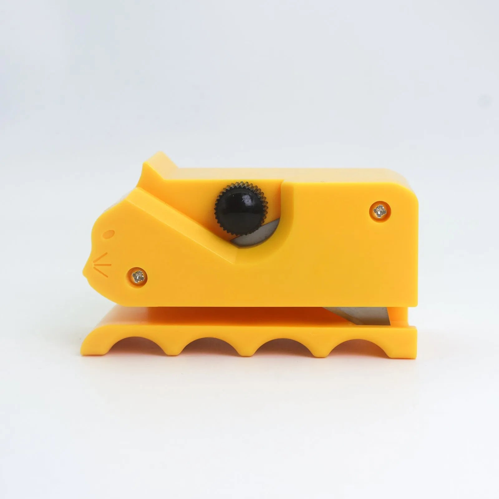 Colourful cartoon cat-shaped cutter for cutting corrugated paper to make scratch boards.