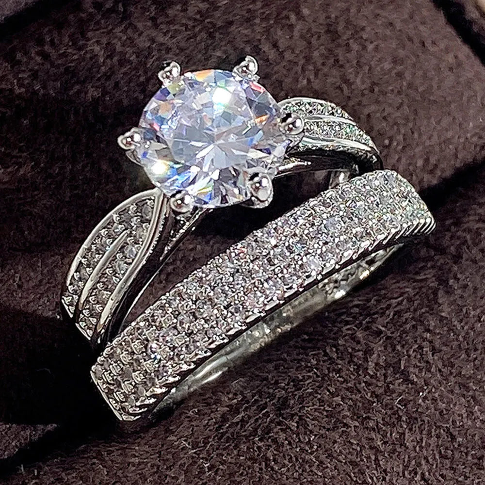 Geometric style wedding ring paired with a matching simple bracelet band in a white gold colour finish.