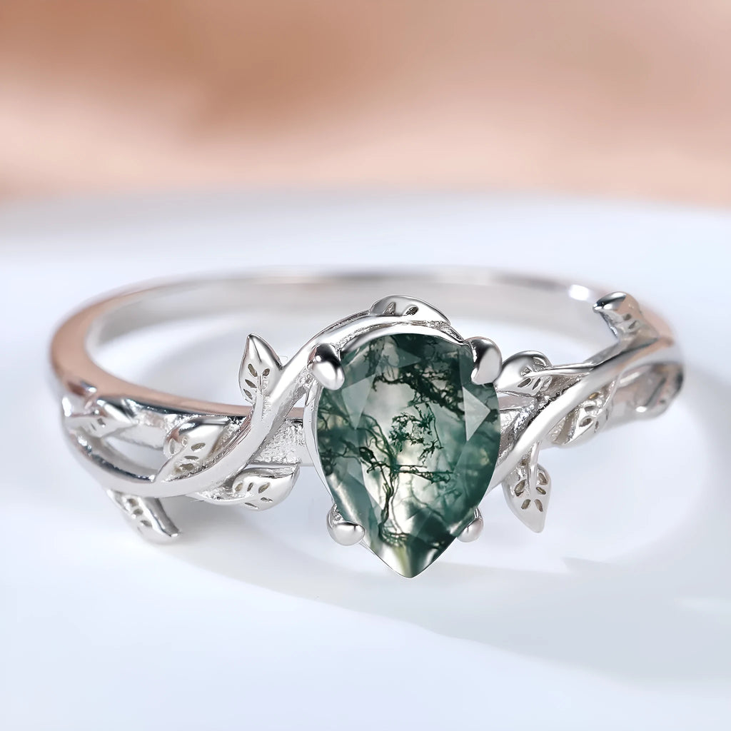 S925 silver ring with drop-shaped natural agate stone and branch leaf edge design on white background