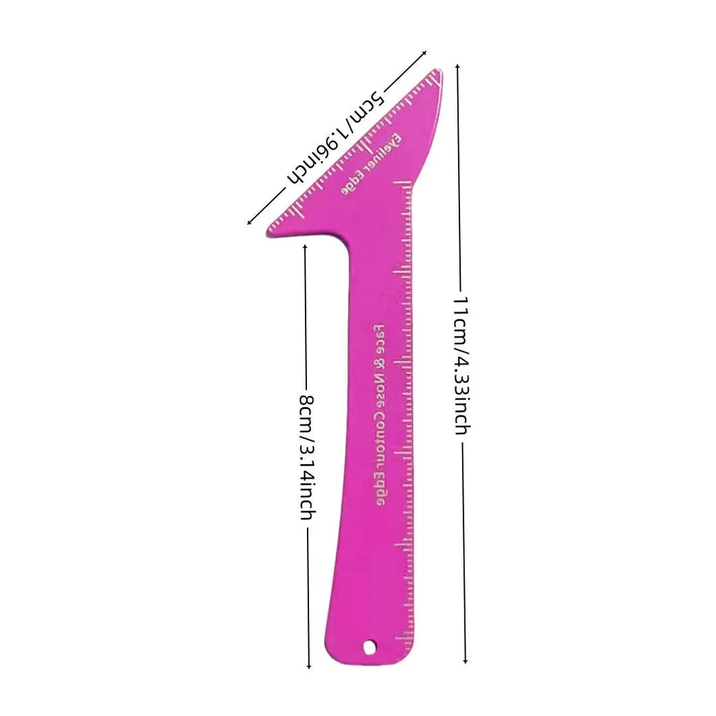 Pink reusable plastic makeup stencil with cut-outs for winged eyeliner, eyebrow arch, and face contour lines on a table.