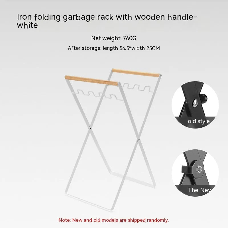 Black folding outdoor trash rack with wooden handle standing on a patio.