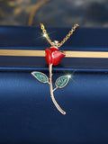 Champagne gold rose pendant necklace with copper drip oil finish and O-ring chain on display