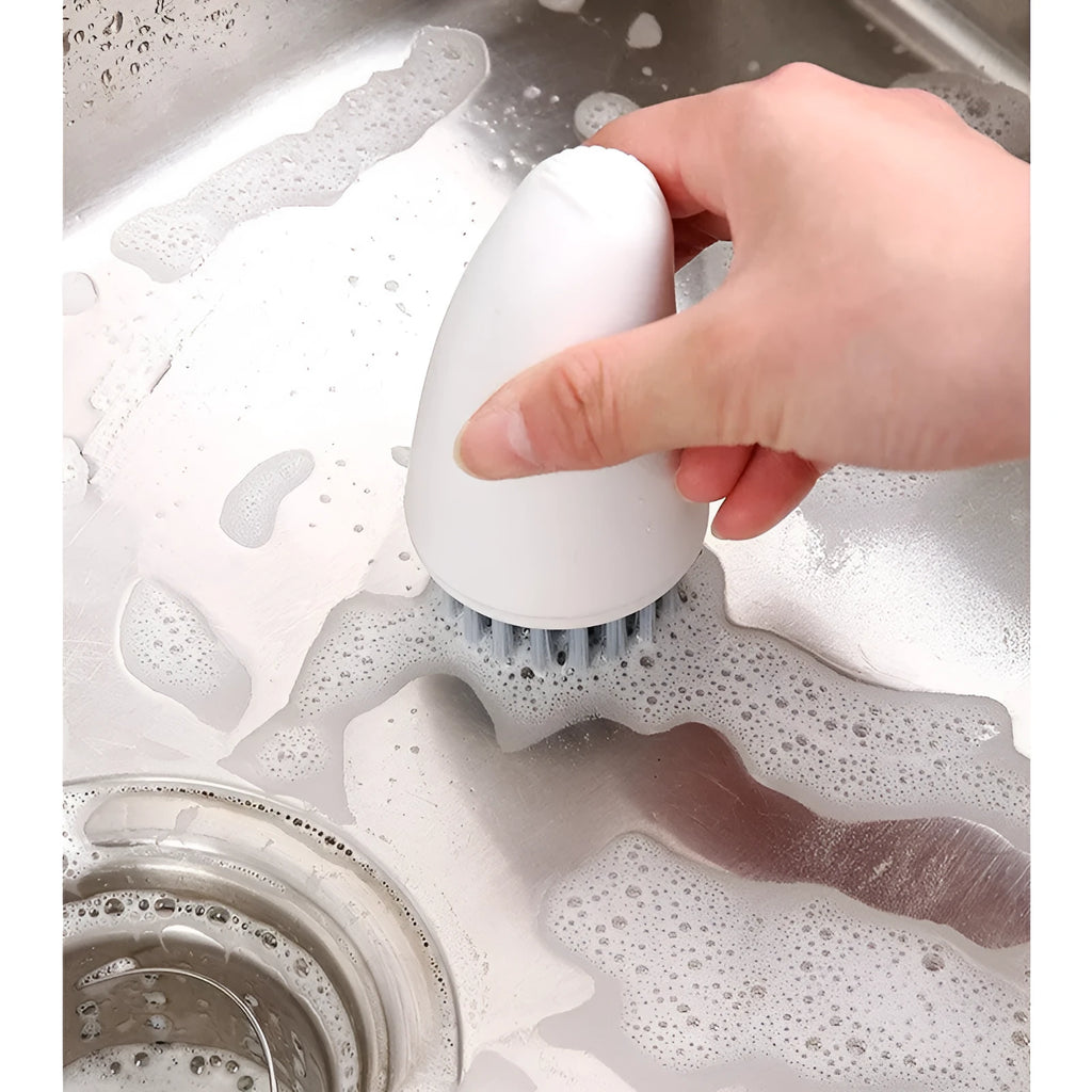 Carrot-shaped nylon cleaning brush in orange and white colours for kitchen vegetable washing