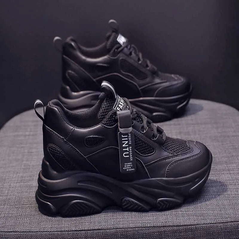 Women's black mesh platform casual shoes with hollow-out design and toe holder on a TPR sole.