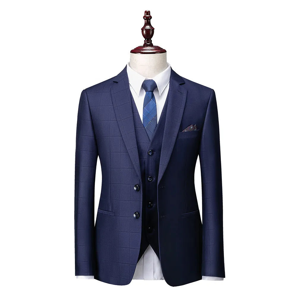 Men's navy blue plaid slim fit three-piece business casual suit on a hanger.
