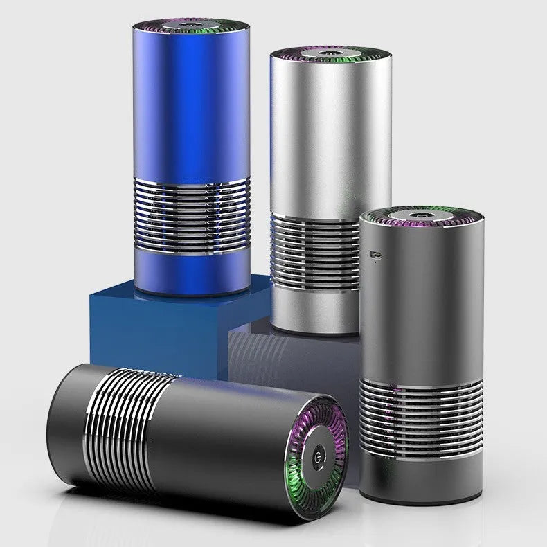 Compact black car and desktop air purifier with aluminium alloy case on a wooden desk.