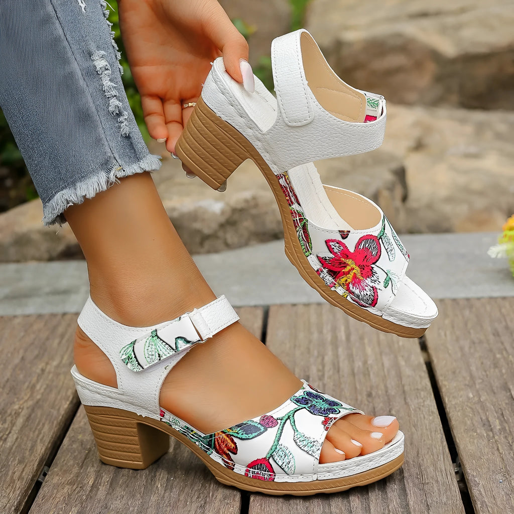 White women's high heel sandals with a Velcro buckle strap and rubber sole