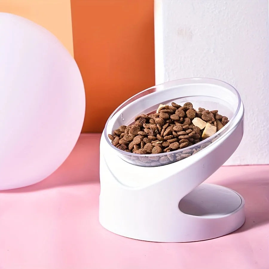 White clear plastic elevated cat food bowl with tilted ergonomic design for neck protection.