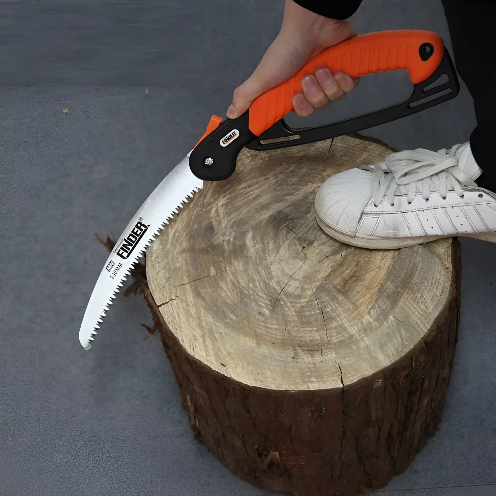 A folding garden saw with a black TPR handle and a metallic 230mm saw blade, shown both open and closed.